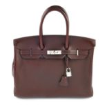 HERMÈS - a 2010 Prune Evergrain Birkin 35 handbag. Crafted from prune coloured, slightly textured