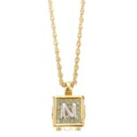 NINA RICCI - a necklace. Featured an embellished gold-tone box charm with maker's initials on each