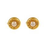 CHANEL - a pair button ear clips. Featuring an imitation pearl to the centre and a matte gold-tone
