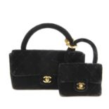 CHANEL - two black velvet Kelly Flap handbags. The twin set, to include a medium and a small