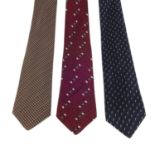 BALENCIAGA - three ties. To include a dark blue tie with a repetitive pattern of French horns