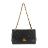 CHANEL - a Small Classic Double Flap handbag. Featuring maker's iconic black quilted lambskin