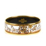 HERMÈS - an enamel bangle. Depicting a horse and carriage scene on a white colored background with