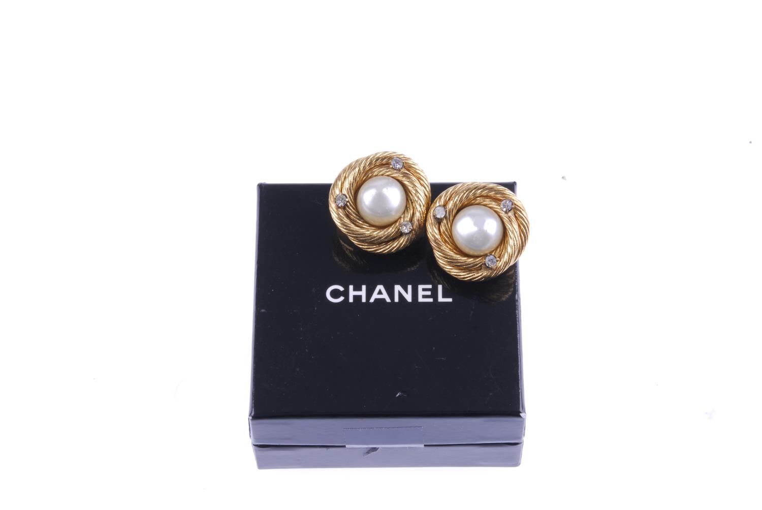 CHANEL - a pair of clip-on earrings. The imitation pearls to the centre, with rope-twist swirl- - Image 3 of 3