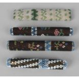 Four late 19th century beadwork decorated needle cases and covers, largest 3.5 (9cm) high. Some