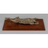 A novelty cold painted bronze desk clip, modelled as a hare, upon spring activated clip and