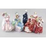 A group of eight Royal Doulton figurines, comprising May Time HN 2113, Christmas Morn HN 1992,