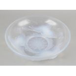 A French opalescent glass dish by Ezan, of shallow circular form, the exterior modelled in the Art