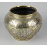 A Middle Eastern Cairo Ware brass planter, with copper and white metal inlay of typical arabesque