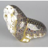 A Royal Crown Derby porcelain paperweight modelled as a walrus, with red printed marks and gold