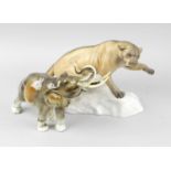 A Beswick figurine modelled as a puma on naturalistic base, 8.25 x 12 (21cm x 30.5cm), together with