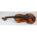 An early to mid 20th century violin. Having a figured two-piece 14, (36cm) back, indistinctly