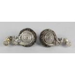 An interesting pair of dated mid-Victorian Elkington cast plated alloy curtain tie backs. Each