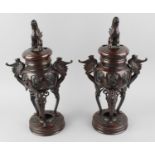 A pair of Japanese patinated bronze koro or incense burners. Each having a heart-pierced removable