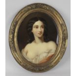 A 19th century oval portrait of a lady. Seemingly reverse-painted onto convex glass (s/d), depicting
