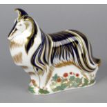 A Royal Crown Derby Imari porcelain paperweight modelled as a rough collie, with red printed marks
