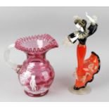 A group of assorted glassware, comprising a jug of bulbous form with frilled flared neck, the pink