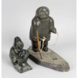 Two Canadian Inuit 'Eskimo Art' greenstone carvings. The first modelled as an ice fisherman