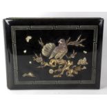 An early 20th century Japanese shibayama photograph album. The black lacquered cover decorated