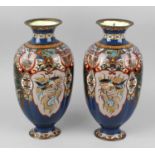 Three cloisonné vases, each of lobed ovoid form with short flared neck, raised upon spreading