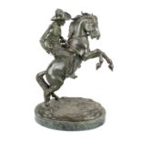 Theodor Ullmann, (fl. early 20th century) A patinated bronze model of a cowboy or bronco rider,