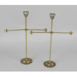 A pair of 19th century brass jewellery stands, each cruciform surmounted by stone set coronets,