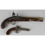 An early 19th century flintlock pistol, the shaped striker upon an engraved plate, marked 'W Jones',