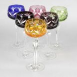 A set of six flash cut hock glasses, each with bowls of different colour upon shaped hexagonal