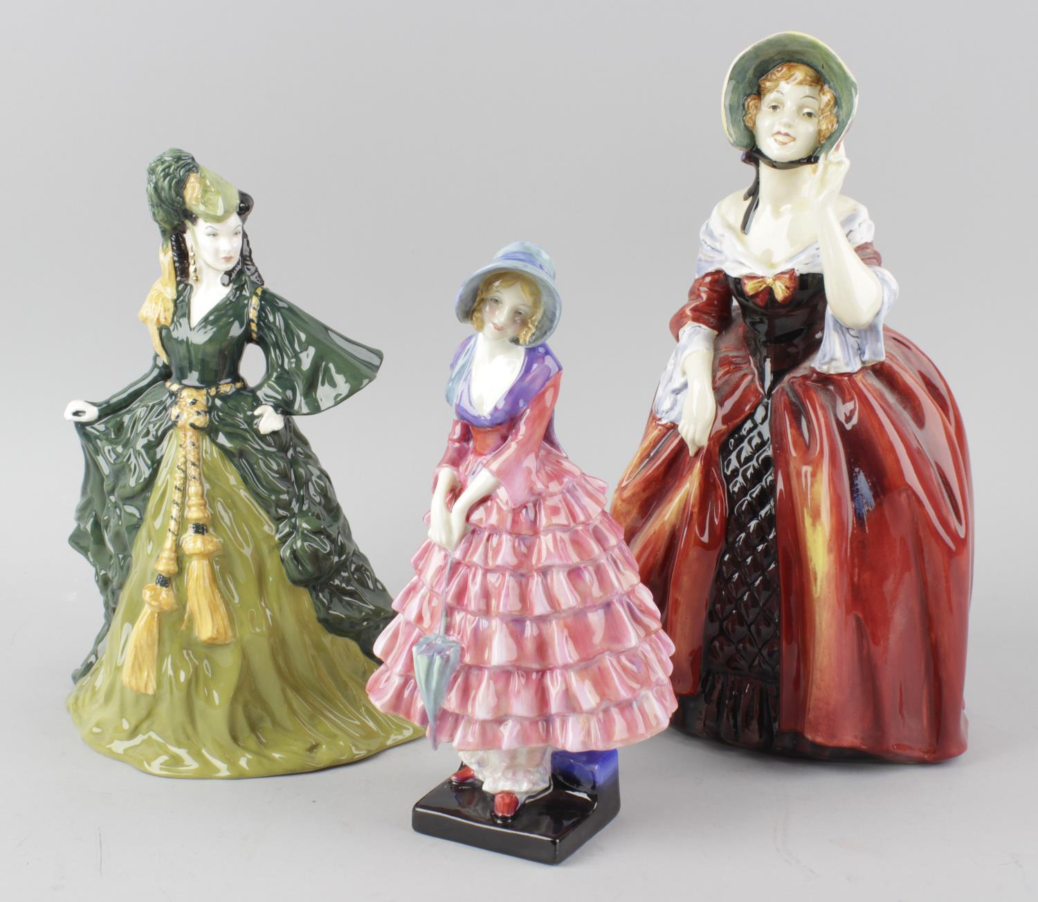 A group of three Royal Doulton figurines, comprising Priscilla HN 1340, Classic Movies Gone with the