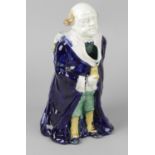 A majolica figural jug, modelled as a portly gentleman in long blue overcoat, 10.5 (26.5cm), (a/