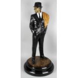 A modern large painted bronze depicting Frank Sinatra, standing, dressed in a trilby hat and black