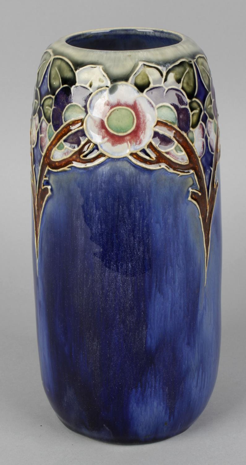 A Royal Doulton stoneware vase, of tapered ovoid shaped form, the blue glazed ground decorated
