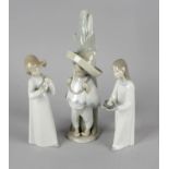 A group of Lladro and other porcelain figures. Comprising: a Mexican child with sombrero and