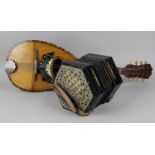 A Lachenal concertina, each of the hexagonal shaped stained wooden ends fitted with pierced metal