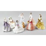 A group of seven Royal Doulton figurines, comprising Daydreams HN 1731, Janet HN 1537, Kathleen HN
