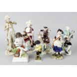 A group of seven porcelain figures. Comprising: a 19th century Meissen porcelain figure of an