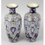 A pair of early to mid 20th century Japanese pottery vases, each of ovoid form with flared neck,