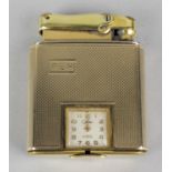 A 9ct gold Colibri lighter, the body of square form with engine turned decoration, having inset