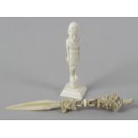 Two items of early 20th century ivory. Comprising an Eastern handle with horse head terminal over