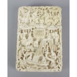 A fine late 19th century Cantonese carved ivory card case of rectangular form, the whole intricately