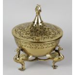 A brass Eastern incense burner and cover, the cauldron body with foliate pierced rim, raised upon