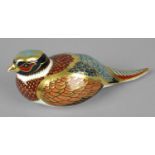 A Royal Crown Derby porcelain paperweight modelled as a woodland pheasant, with red printed marks
