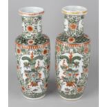 A pair of 20th century Chinese vases, each of cylindrical form with waisted neck, the white glazed
