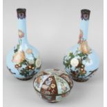 A pair of cloisonné vases, of fluted ovoid form with flared neck, raised upon spreading foot,