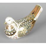 A Royal Crown Derby porcelain paperweight modelled as a dove, with red printed marks and gold