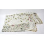 An early 20th century hand-stitched settee cover. Decorated with all-over floral sprays and sprigs