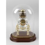 A Comitti brass-framed skeleton clock. The 3.5-inch silvered lobed Roman chapter ring, the single-