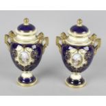 A pair of Coalport urns and covers, the ovoid bodies with twin figural handles and waisted necks