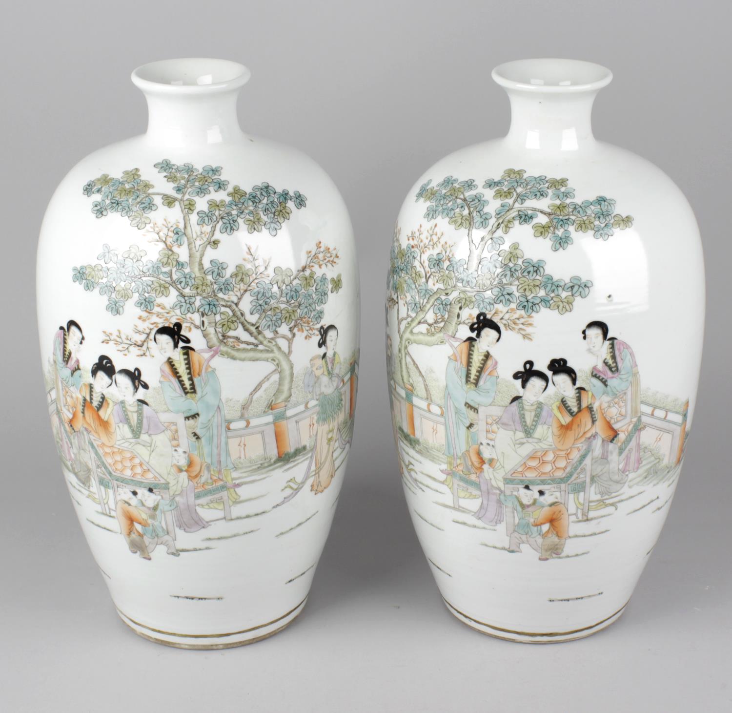 A pair of early 20th century Chinese vases, each of ovoid form, the white glazed ground decorated