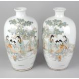 A pair of early 20th century Chinese vases, each of ovoid form, the white glazed ground decorated